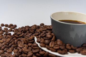 Coffee beans and coffee on a white background