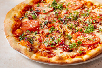 A view of a tomato Mediterranean pizza.