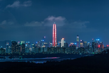 Obraz premium Skyline of downtown district of Shenzhen city, China at night. Viewed from Hong Kong border