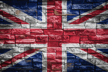National flag of United Kingdom. on stone  wall background.The concept of national pride and symbol of the country. Flag  banner on  stone texture background.