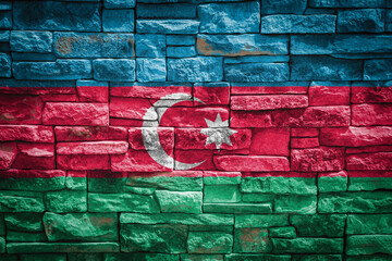 National flag of Azerbaijan on stone  wall background.The concept of national pride and symbol of the country. Flag  banner on  stone texture background.
