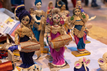 Handmade puppet models of musicians and dancers with traditional costumes made of Jute isolated on...