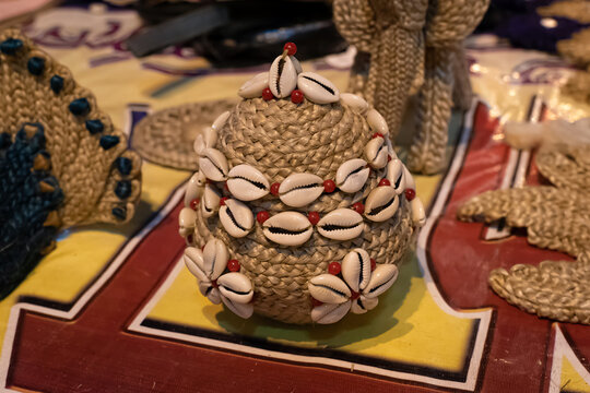 Beautiful handmade decorative basket made by jute is displayed in a shop for sale in blurred background. Indian handicraft
