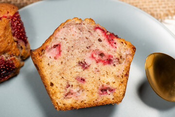 Homemade baked muffins with delicious fresh strawberries