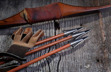 Longbow Riser with Hunting Arrows