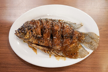 Honey roasted gourami. Grilled Gourami with Honey Glaze and Burnt Butter. Asian dish cuisine culinary