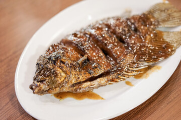 Honey roasted gourami. Grilled Gourami with Honey Glaze and Burnt Butter. Asian dish cuisine culinary