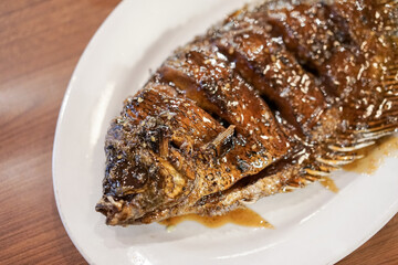 Honey roasted gourami. Grilled Gourami with Honey Glaze and Burnt Butter. Asian dish cuisine culinary
