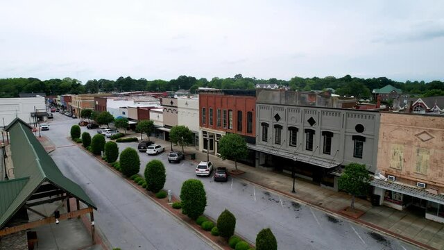 Seneca downtown shot, Seneca SC, Seneca South Carolina with American flag in foreground