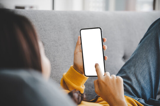Woman using mobile smartphone and device white screen empty space smart phone, clipping path included