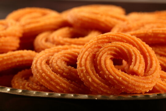 Homemade Indian snack food- chakli, muruku, murukku .spicy savory dish.