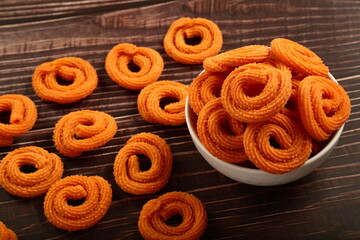 Vegan snack foods- homemade delicious and spicy chakli, murukku, muruku  from Indian cuisine.