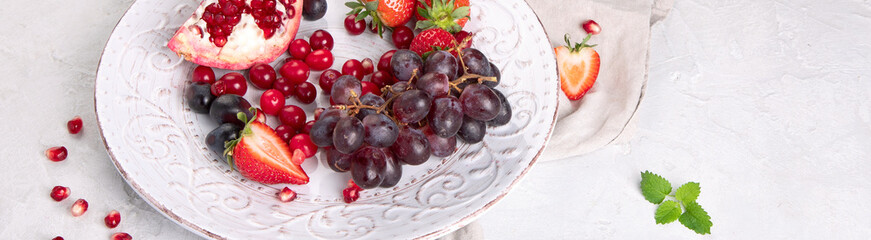 Various fresh forest berries on white background. Organic food concept.