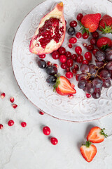 Various fresh forest berries on white background. Organic food concept.