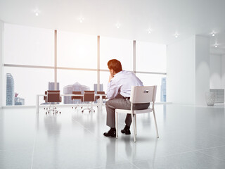 Young businessman sitting on an office chair