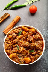 Homemade delicious Kerala style mutton curry, roast with exotic Indian spices.