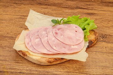 Slised ham snack over board