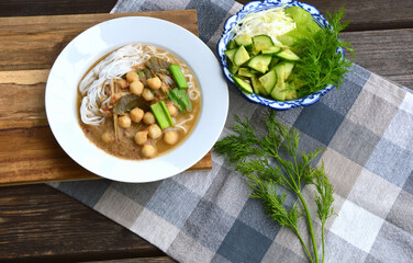 Rice noodles in pickled fish with herb and curry soup with small fish balls Serve with many vegetables. ( Thai name is Kanom Jeen Nam Ya Pa )