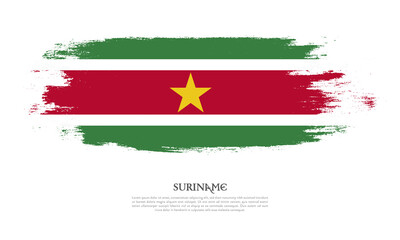 Suriname flag brush concept. Flag of Suriname grunge style banner background