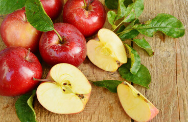 Red apple or Gala apple group with slice and water drop on wooden background.