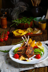 Lamb chops marinated in herbs with green asparagus and lime