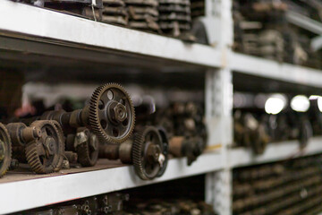 Automotive spare parts on shelf pallet in industrial storage warehouse - obrazy, fototapety, plakaty