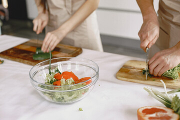 Happy asian couple have fun in modern kitchen indoor