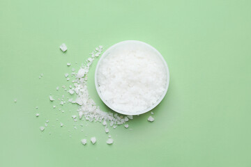 Jar of body scrub on color background