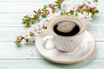 Morning espresso coffee cup and cherry blossom