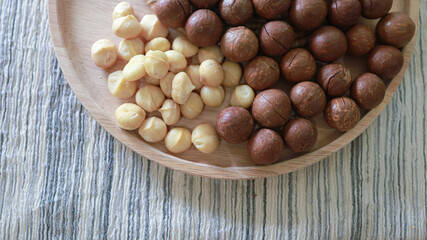 Organic Macadamia nut. macadamia nuts are cracked and baked to taste extremely delicious superfood fresh natural shelled unsalted raw macadamia and healthy food concept