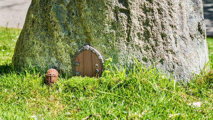 Fairy house door in huge stone fantasy world