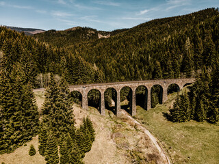 Historic railway viaduct situated in the forest near Telgart in Slovakia Aerial view. Chmarossky...