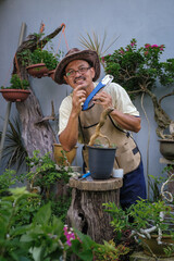 A man is grafting bougainvillea flower tree step by step in the garden