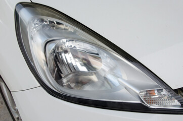 White car right-hand headlight