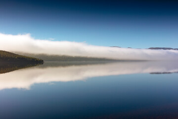 Morning fog over the Loch Ness in Scotland