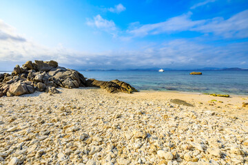 Landscape with beach,the sea and the beautiful clouds in the blue sky.rocks on the beach.