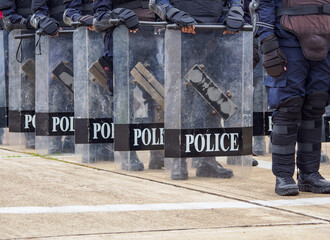 Riot police practice shields and baton
