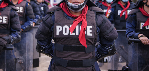 Riot police practice shields and baton