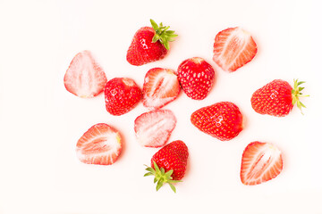 A lot of ripe juicy strawberries in milk, cream or yogurt.