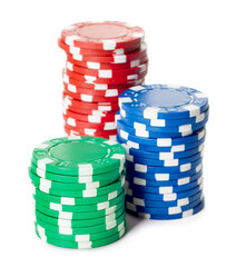 pile of various casino chips isolated on white background