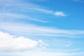 blue clear sky with cirrus storm clouds, horizontal.