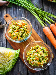 Fresh spring vegetable salad on wooden table