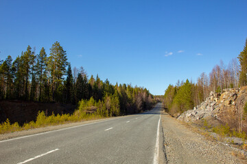 Fototapeta na wymiar The road through beautiful places. Travel along the picturesque roads of the Urals and Siberia