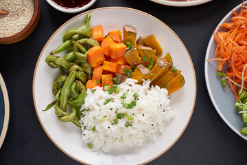 Healthy Organic Tofu and Rice Buddha Bowl with Veggies. Poke bowl with silken tofu, rice and mixed vegetables, carrots, asparagus, tomatoes, beans . Healthy vegetarian salad bowl.