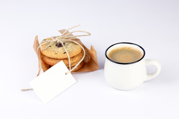 Hot black coffee with foam and sweet chocolate cookies on white background. Part of set.