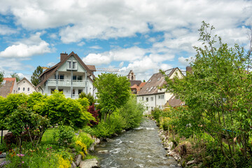 Fototapeta na wymiar Brook flowing through the town center of Kirchzarten