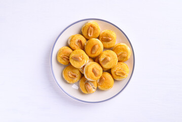 Peanut cookies or Asian cookies singapore on plate with white background, Top view