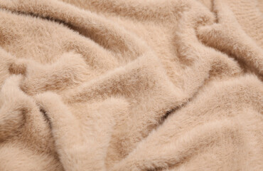 Fototapeta na wymiar Soft beige fabric texture of sweater close up