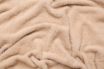 Naklejka na ściany i meble Soft beige fabric texture of sweater close up