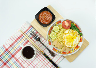 Indonesian Mie Goreng or Fried Noodle with egg traditional Indonesian or Chinese food with white background